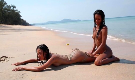Mulatto and Asian - lesbians love sex outdoors, on the beach...
