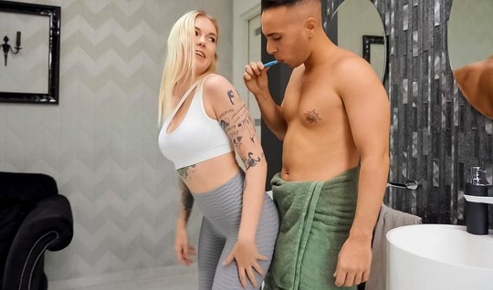 Tattooed blonde in leggings enjoys sexual pleasures